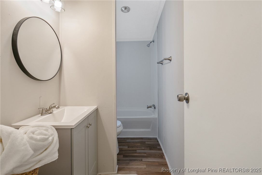 43 Columbus Court Spring Lake, NC 28390 - Photo 20 of 22 a bathroom with a sink and a mirror