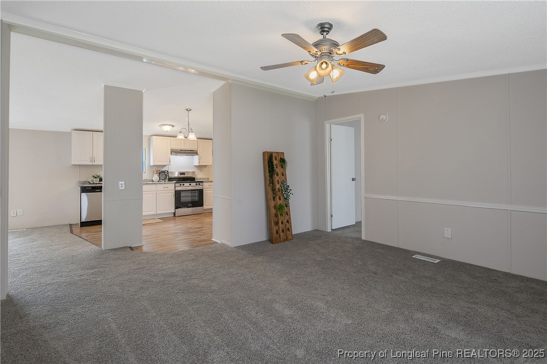 43 Columbus Court Spring Lake, NC 28390 - Photo 5 of 22 a view of an empty room with a ceiling fan