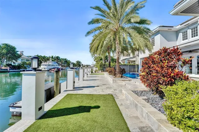 a large kitchen with kitchen island a sink stainless steel appliances and cabinets