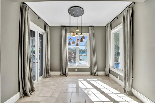 a bathroom with a granite countertop double vanity sink mirror and toilet