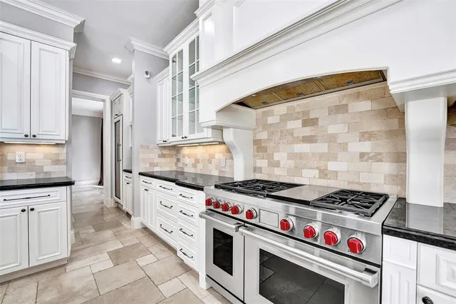 a view of a hallway with a ceiling fan