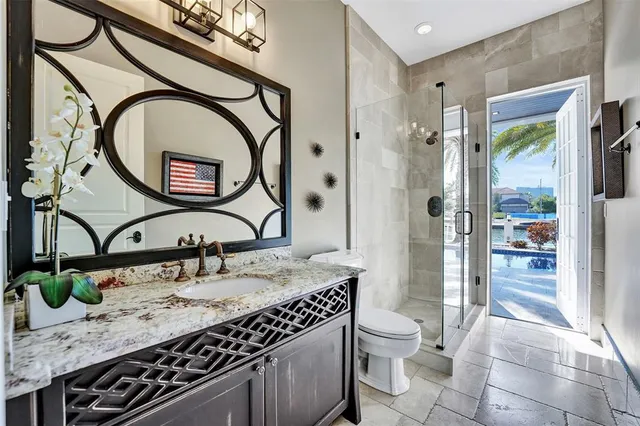 a bathroom with a shower and toilet