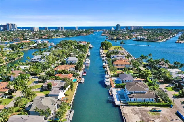 an aerial view of residential building and lake
