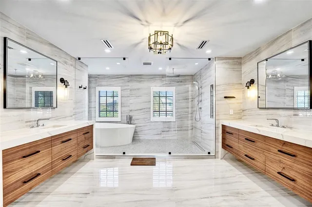 a view of a swimming pool with a lawn chairs and swimming pool