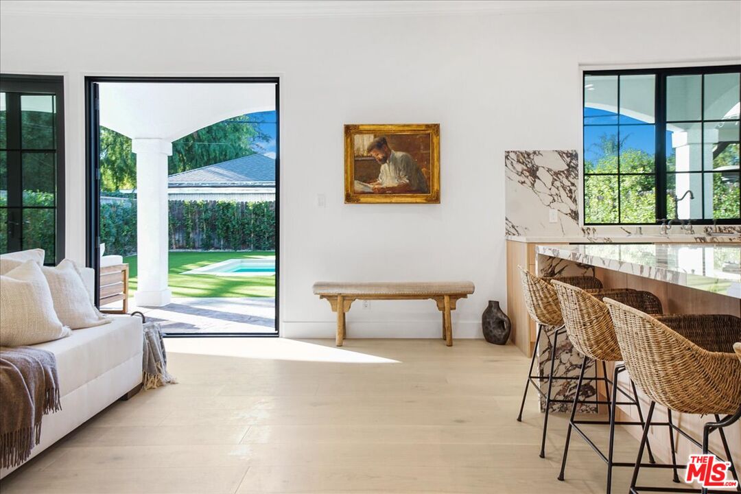 5717 Topeka Drive Tarzana, CA 91356 - Photo 15 of 52 a living room with furniture and a large window