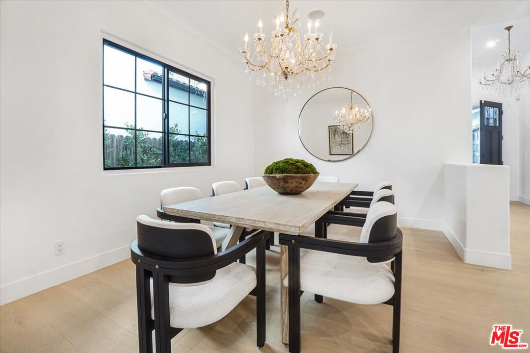 5717 Topeka Drive Tarzana, CA 91356 - Photo 20 of 52 a view of a dining room with furniture and chandelier