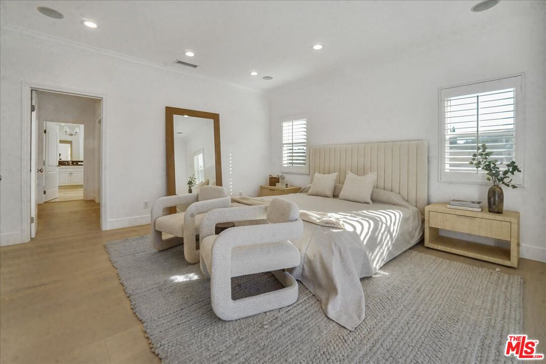 5717 Topeka Drive Tarzana, CA 91356 - Photo 29 of 52 a bedroom with bed and window