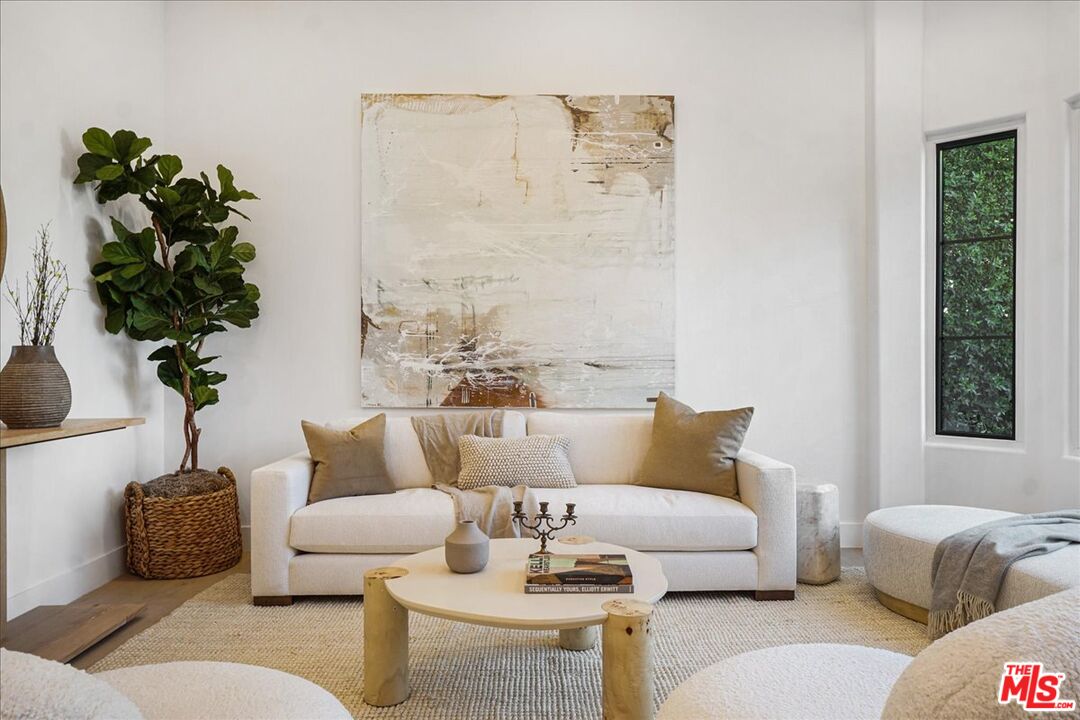 5717 Topeka Drive Tarzana, CA 91356 - Photo 3 of 52 a living room with furniture and a potted plant