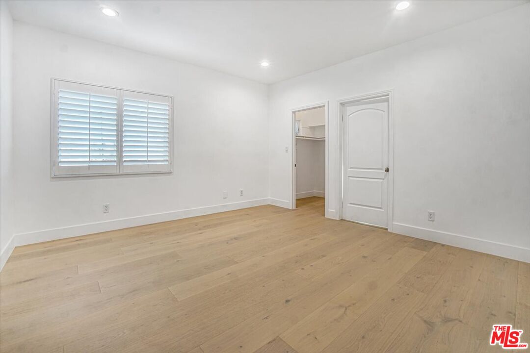 5717 Topeka Drive Tarzana, CA 91356 - Photo 41 of 52 an empty room with a natural light