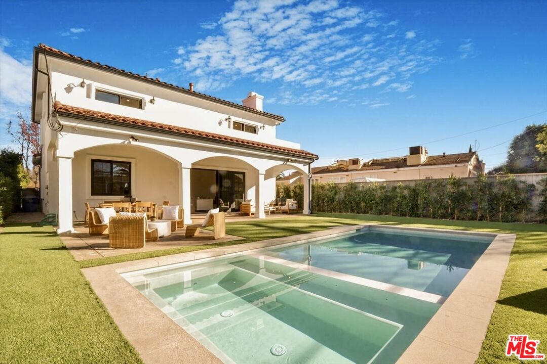 5717 Topeka Drive Tarzana, CA 91356 - Photo 43 of 52 a view of a white building with a outdoor space