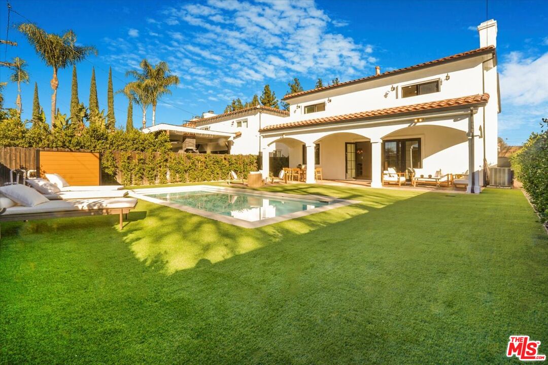5717 Topeka Drive Tarzana, CA 91356 - Photo 44 of 52 a front view of house with a garden