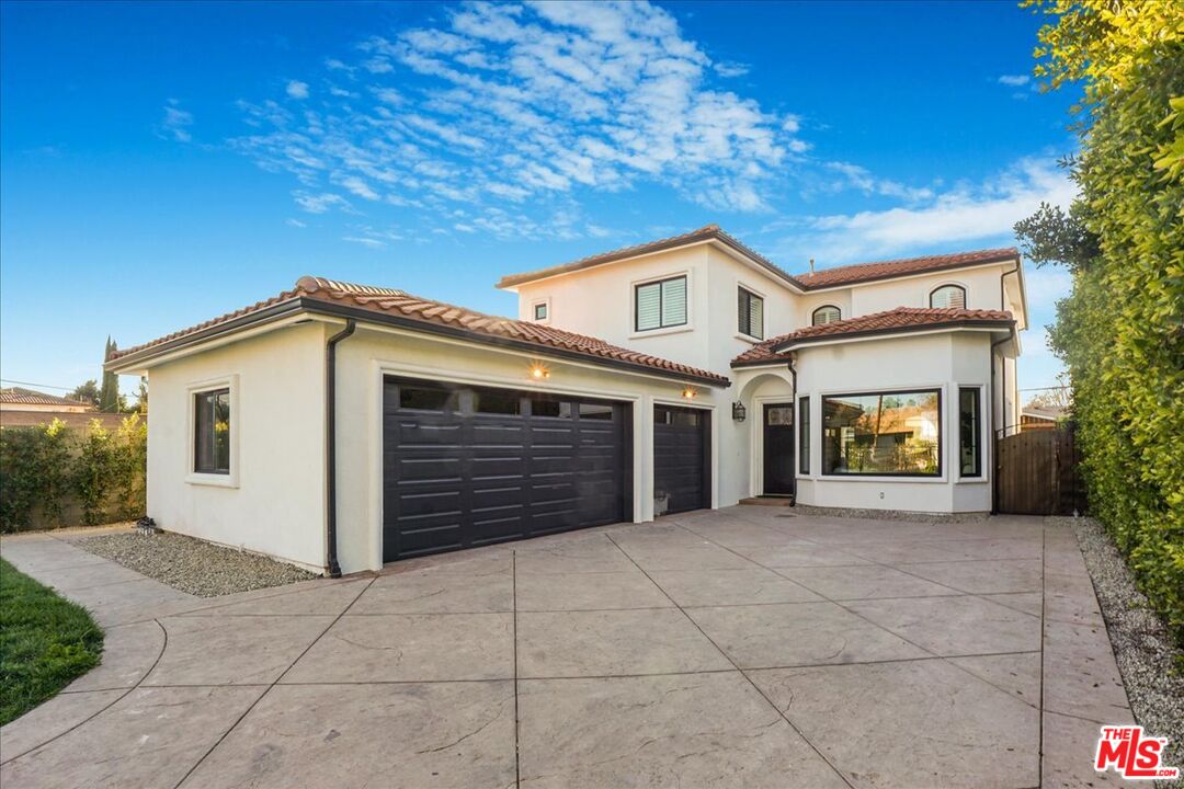 5717 Topeka Drive Tarzana, CA 91356 - Photo 51 of 52 a front view of a house with a garage