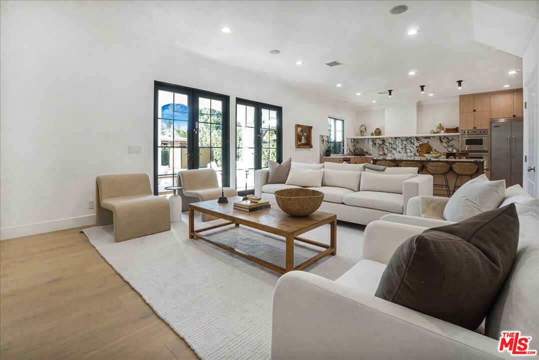 5717 Topeka Drive Tarzana, CA 91356 - Photo 9 of 52 a living room with furniture and a large window