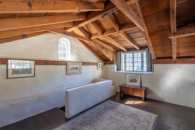 a bed room with a bed and a window