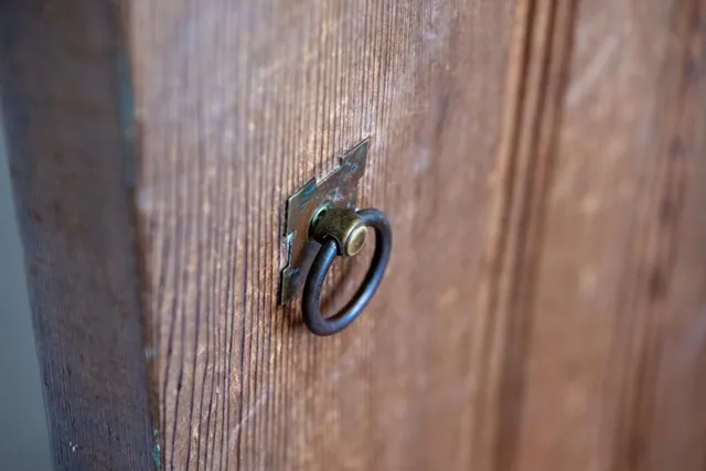 a backyard of a house with a garden and outdoor seating
