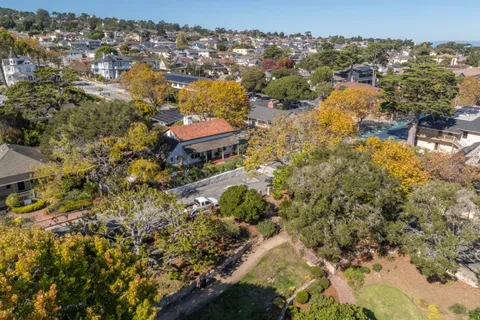 an aerial view of a house with a lake view