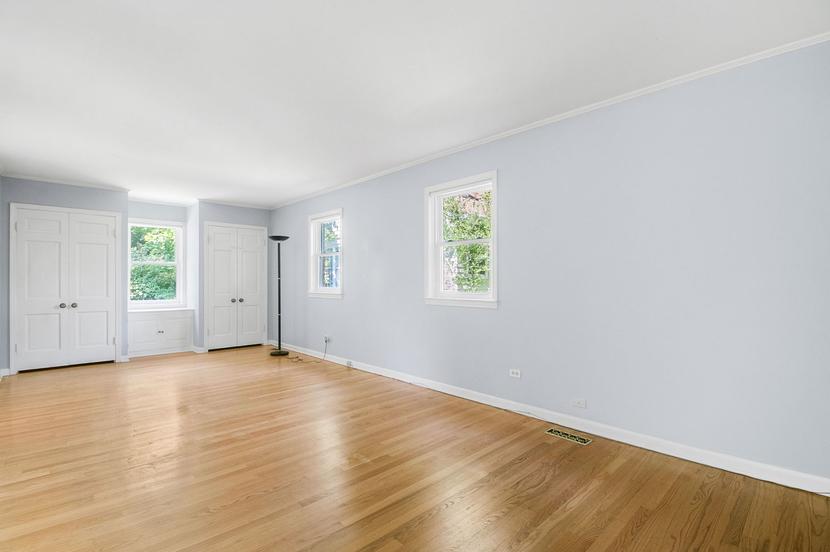 381 Wilson Street Winnetka, IL 60093 - Photo 12 of 28 an empty room with wooden floor and windows