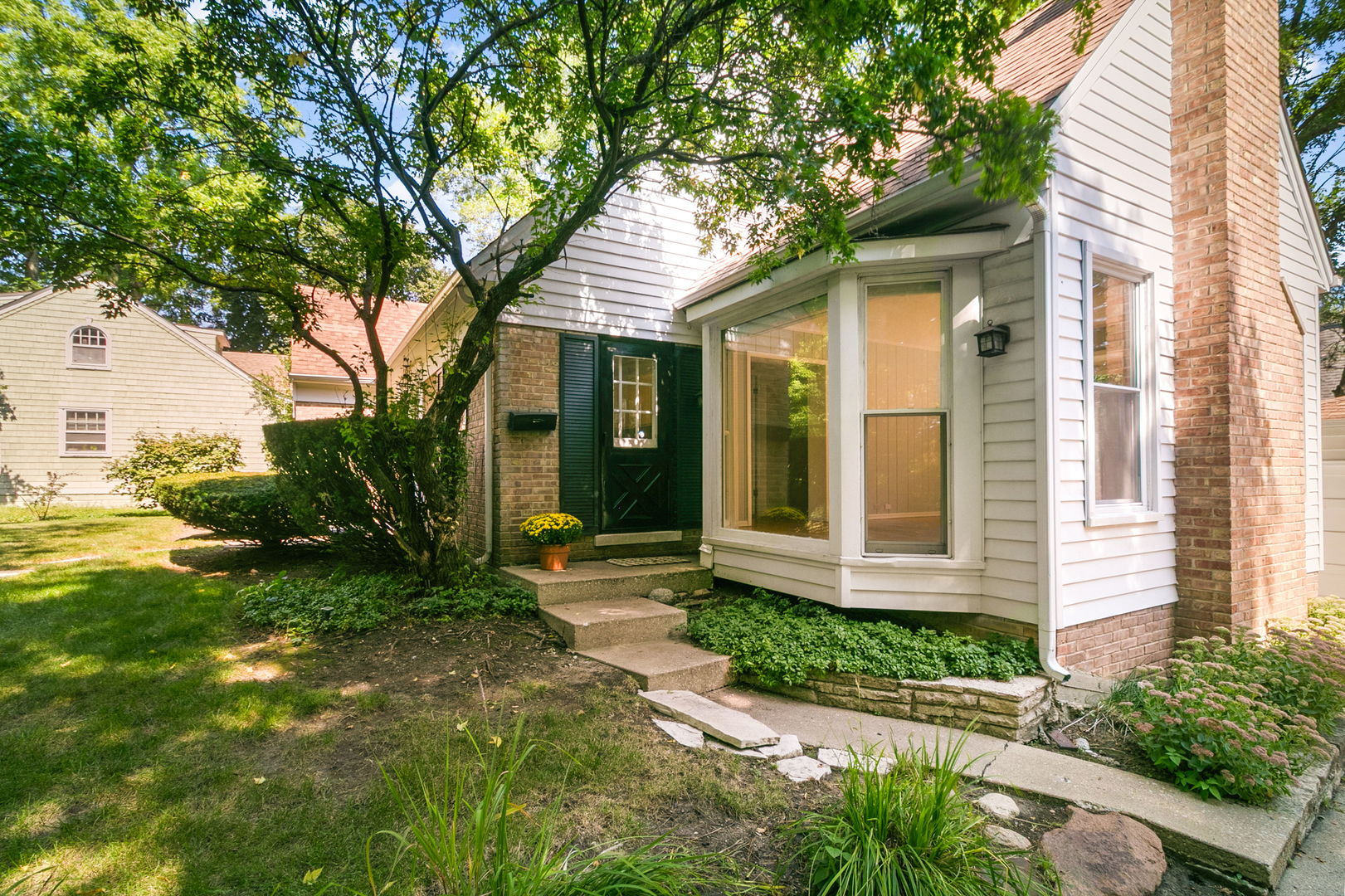 381 Wilson Street Winnetka, IL 60093 - Photo 2 of 28 a front view of a house with garden