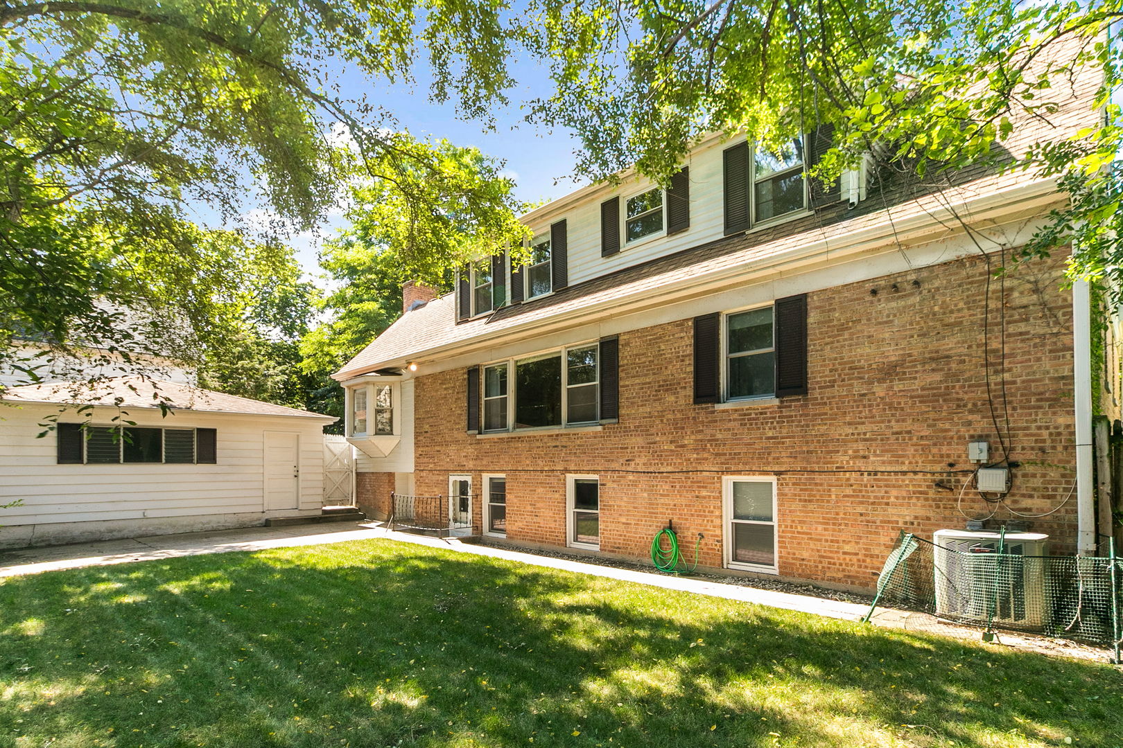 381 Wilson Street Winnetka, IL 60093 - Photo 22 of 28 a backyard of a house with seating space