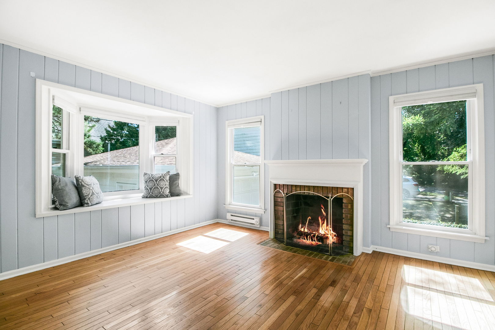 381 Wilson Street Winnetka, IL 60093 - Photo 6 of 28 a view of a livingroom with furniture a fireplace and wooden floor