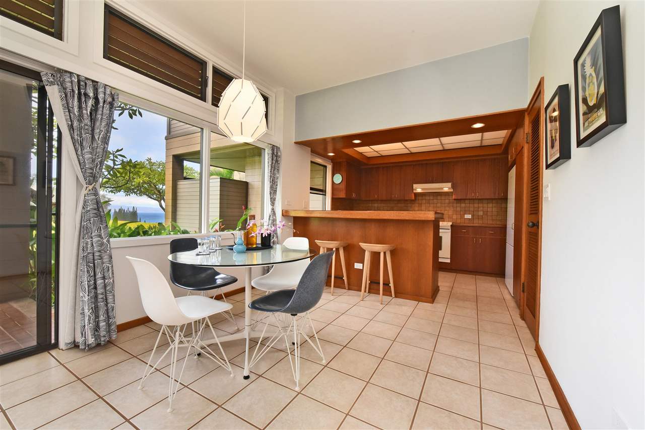 a view of a dining room with furniture and a rug