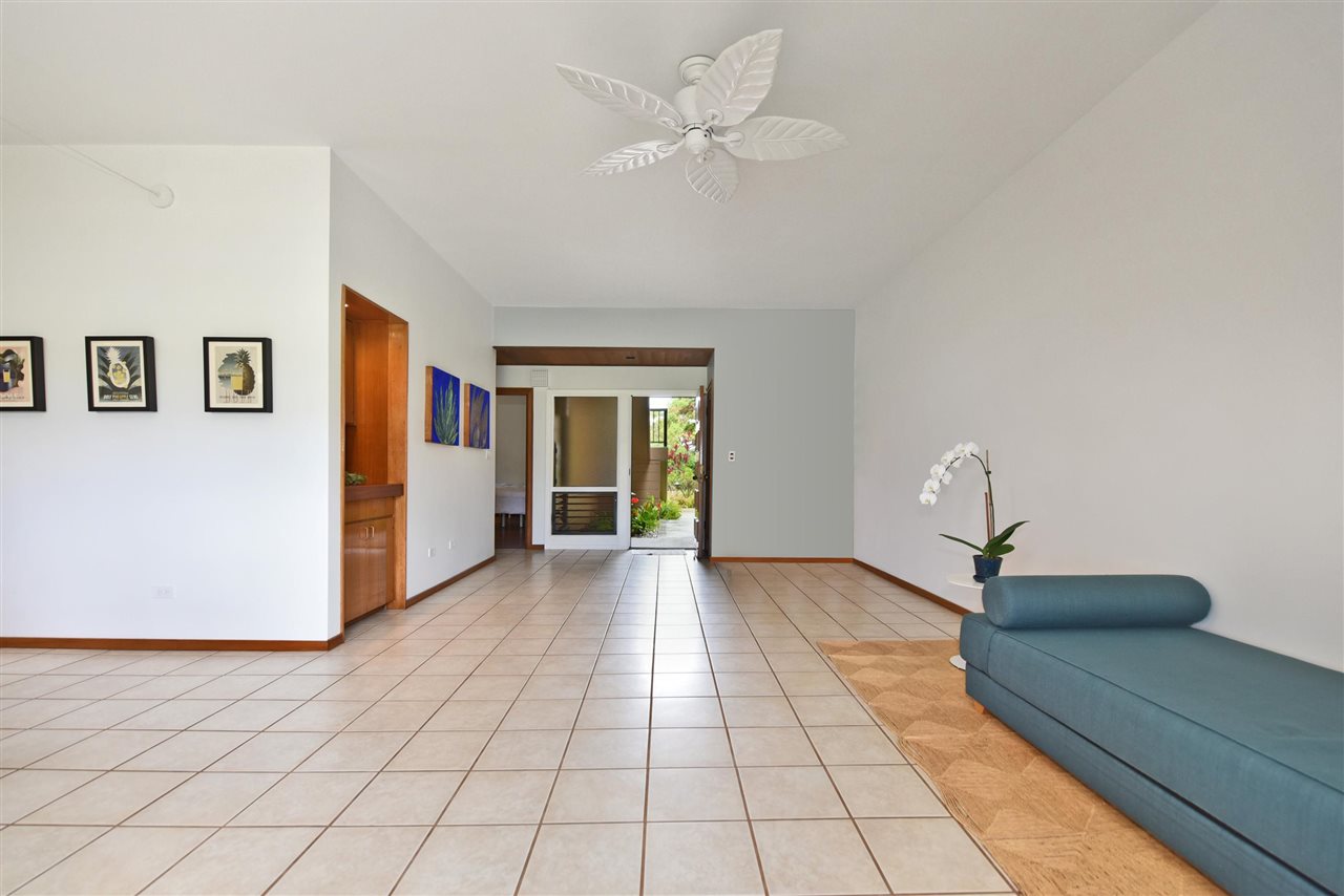 100 Ridge Road, Unit 2312 Lahaina, HI 96761 - Photo 12 of 30 a view of a livingroom with an entryway and a ceiling fan