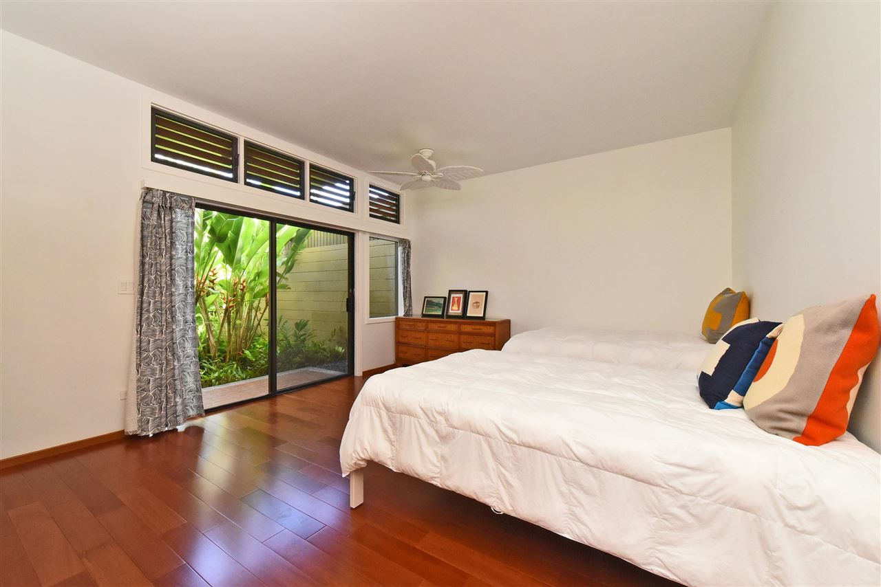 100 Ridge Road, Unit 2312 Lahaina, HI 96761 - Photo 19 of 30 a bedroom with a bed and a large window