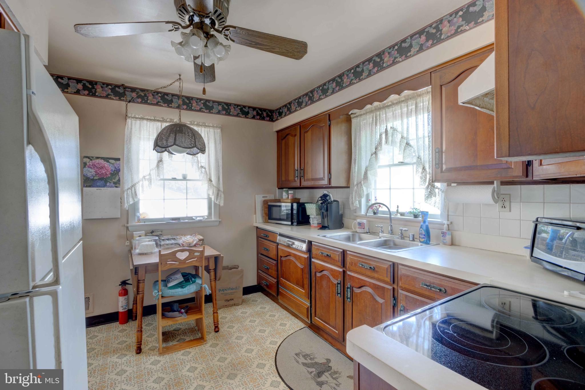 417 Everett Road Monkton, MD 21111 - Photo 11 of 31 a kitchen with stainless steel appliances kitchen island granite countertop a sink stove and cabinets