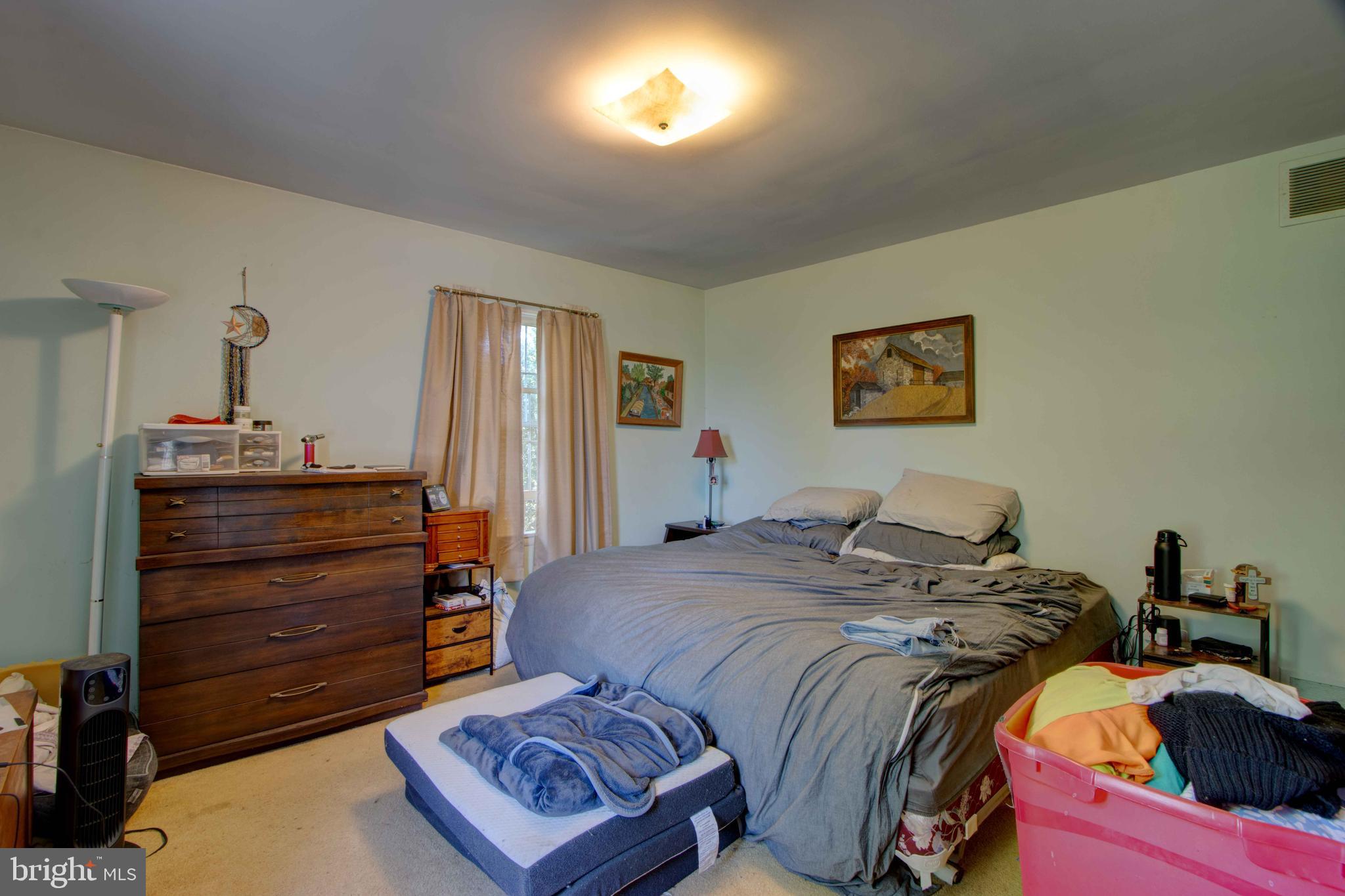 417 Everett Road Monkton, MD 21111 - Photo 14 of 31 a bedroom with a bed and a lamp on dresser