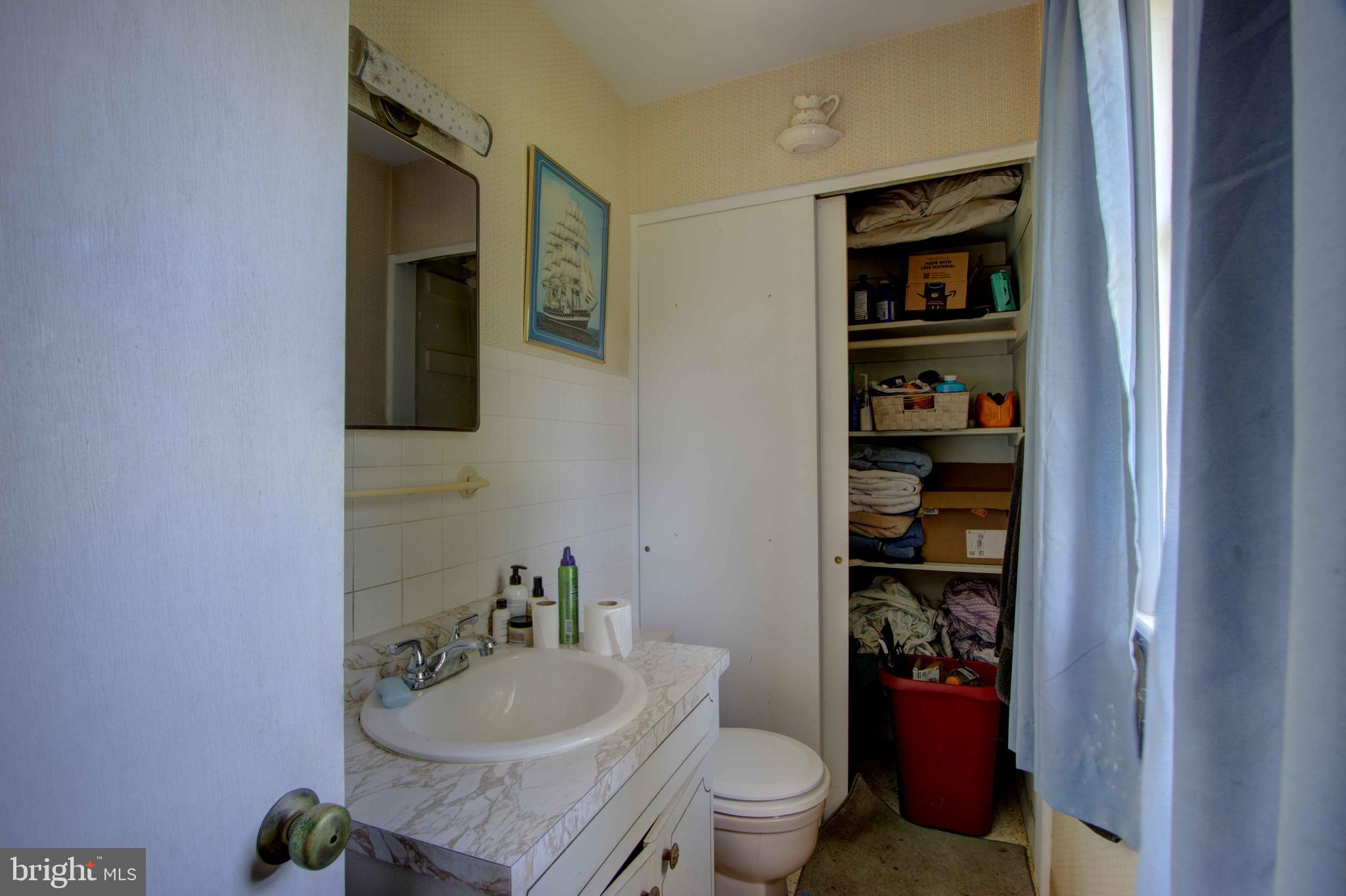 417 Everett Road Monkton, MD 21111 - Photo 24 of 31 a bathroom with a granite countertop toilet and a sink