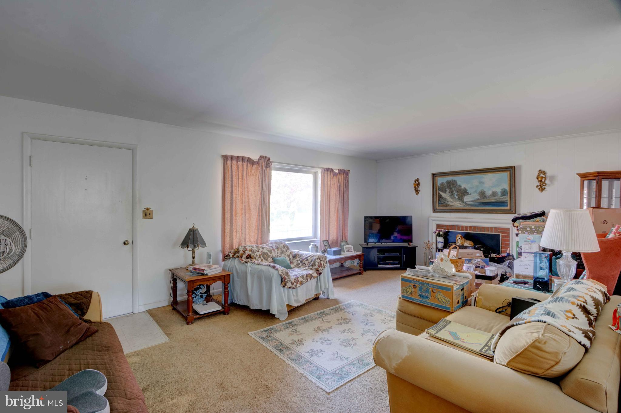 417 Everett Road Monkton, MD 21111 - Photo 7 of 31 a living room with furniture and a fireplace