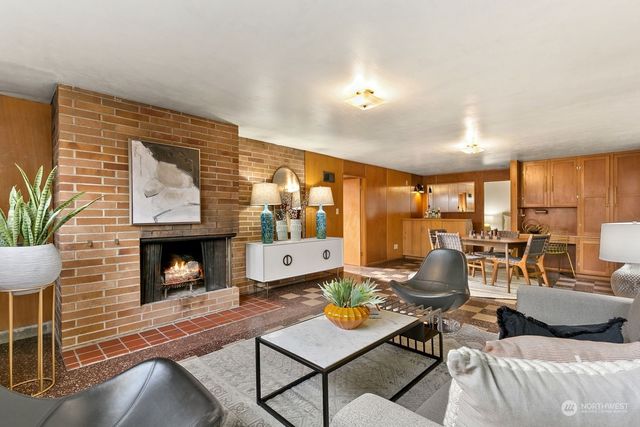 a living room with furniture and fireplace