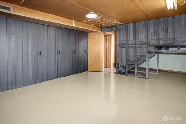a view of a kitchen with a sink and cabinets