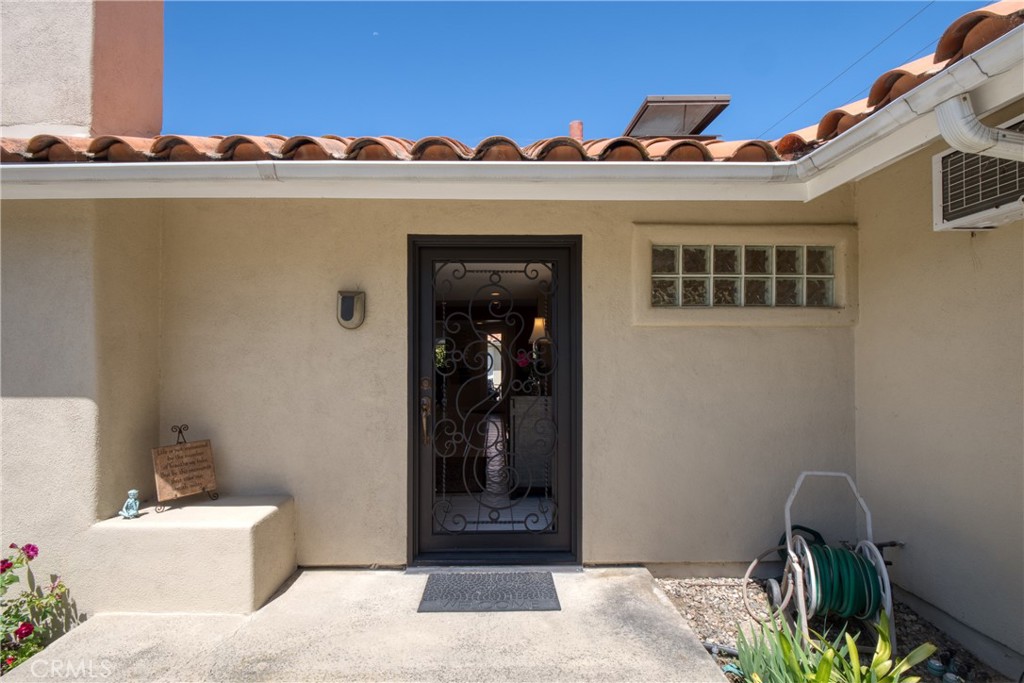 12051 Old Mill Road Los Alamitos, CA 90720 - Photo 7 of 50 Front door open with the custom security gate in the closed position.