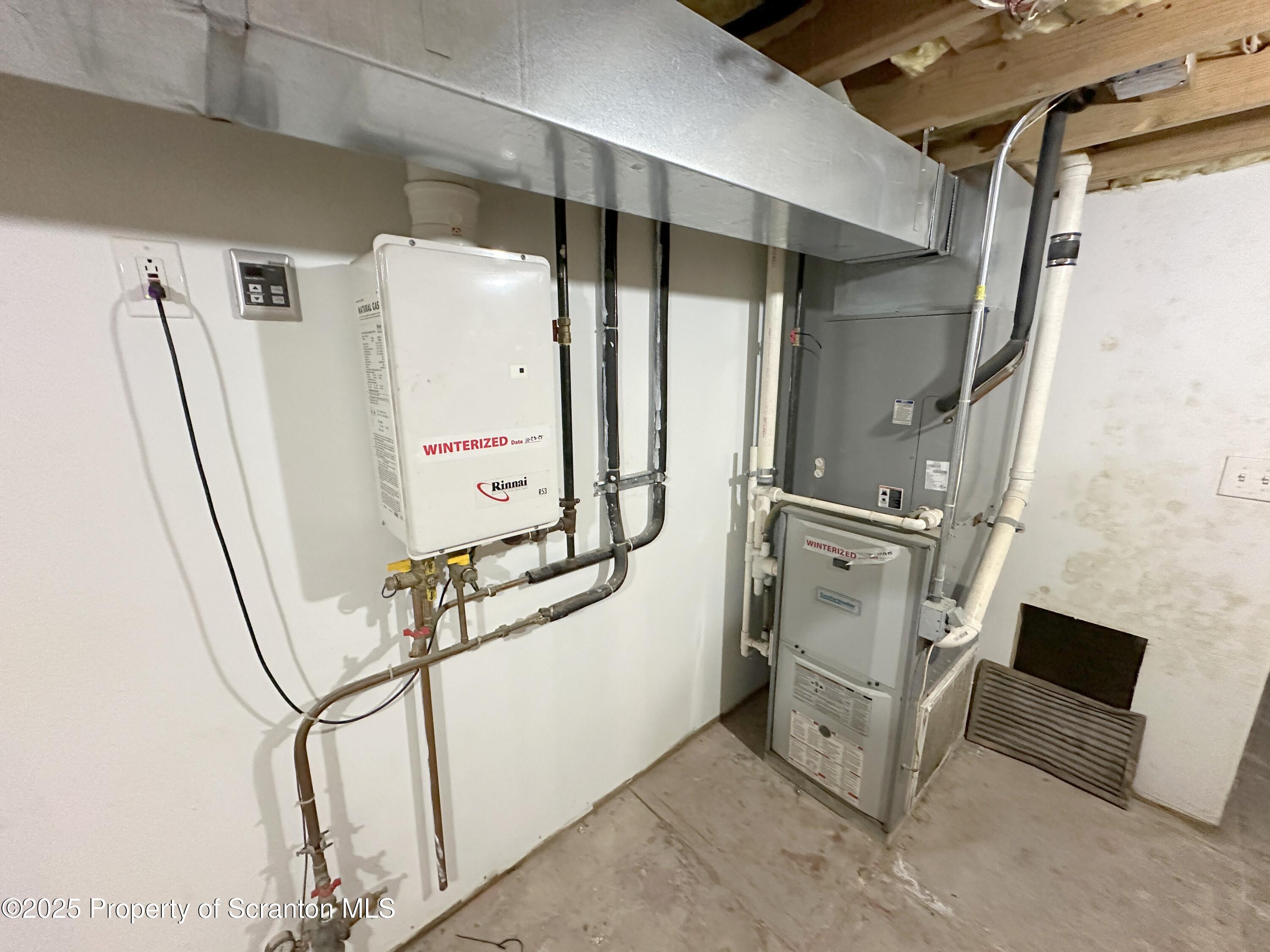 534 2nd Avenue Jessup, PA 18434 - Photo 13 of 14 a view of cabinets with stainless steel appliances wooden floor and chair