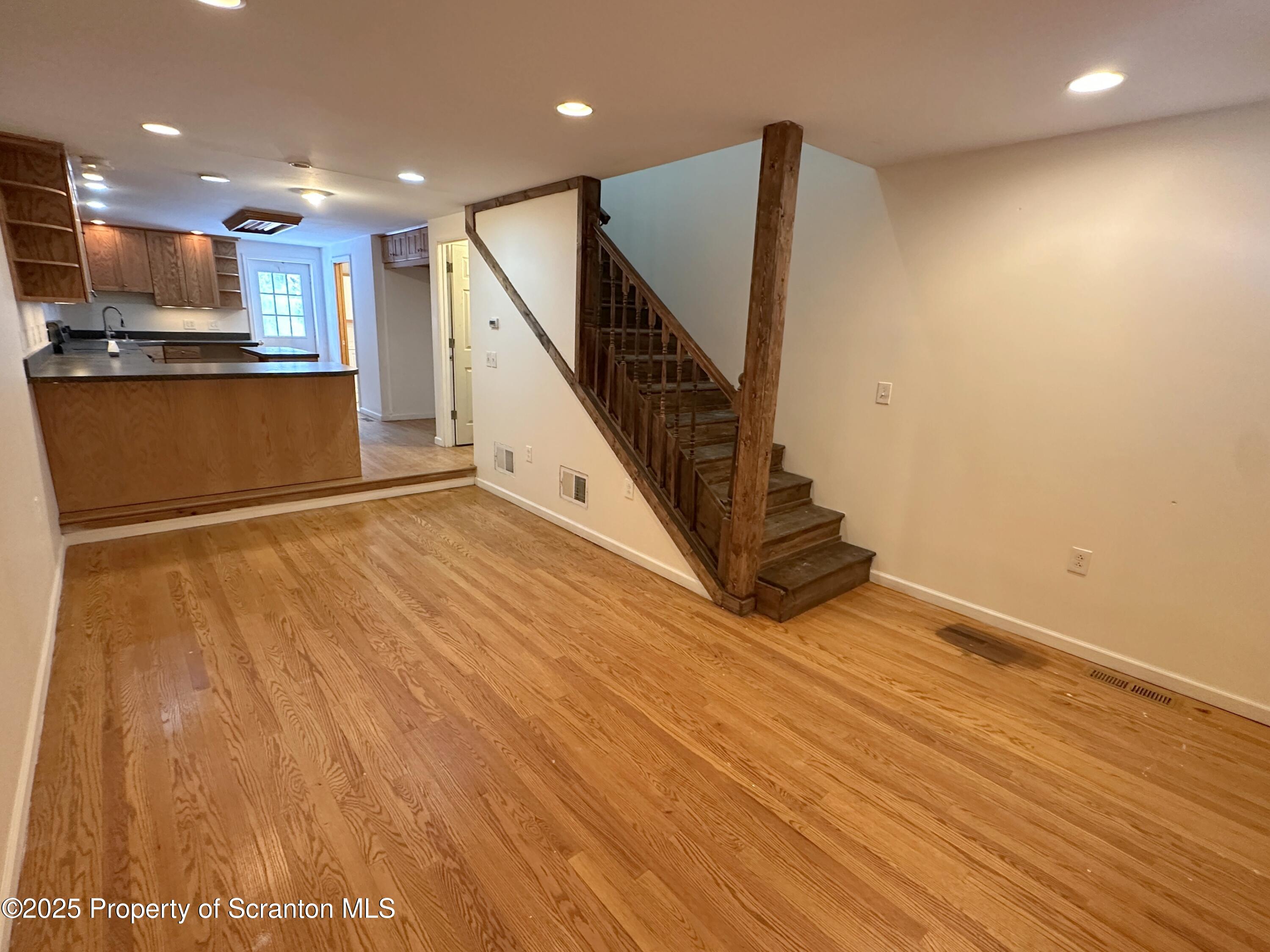 534 2nd Avenue Jessup, PA 18434 - Photo 3 of 14 a view of kitchen with wooden floor and electronic appliances