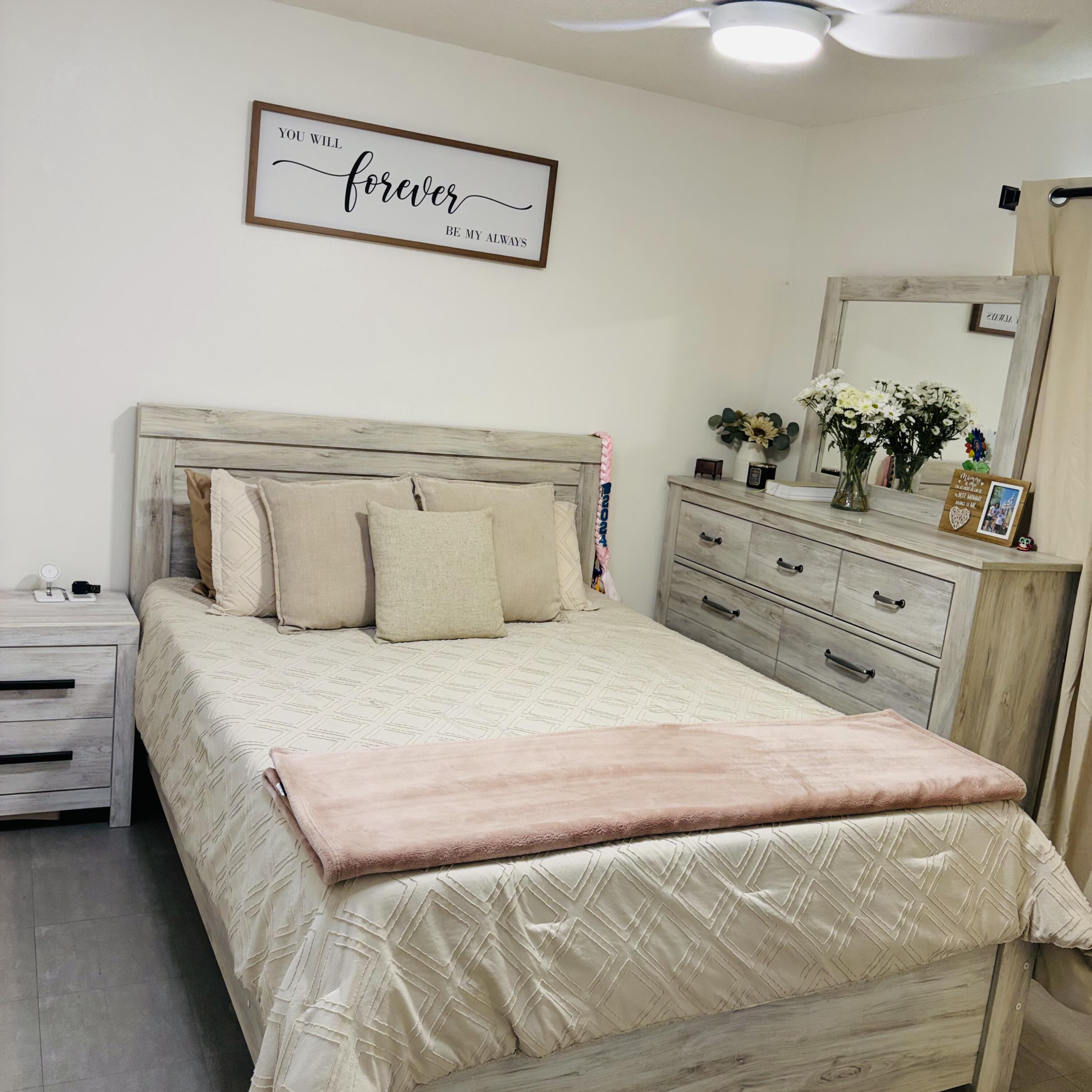 82165 Crest Avenue Indio, CA 92201 - Photo 13 of 37 a large bed sitting in a bedroom and dresser