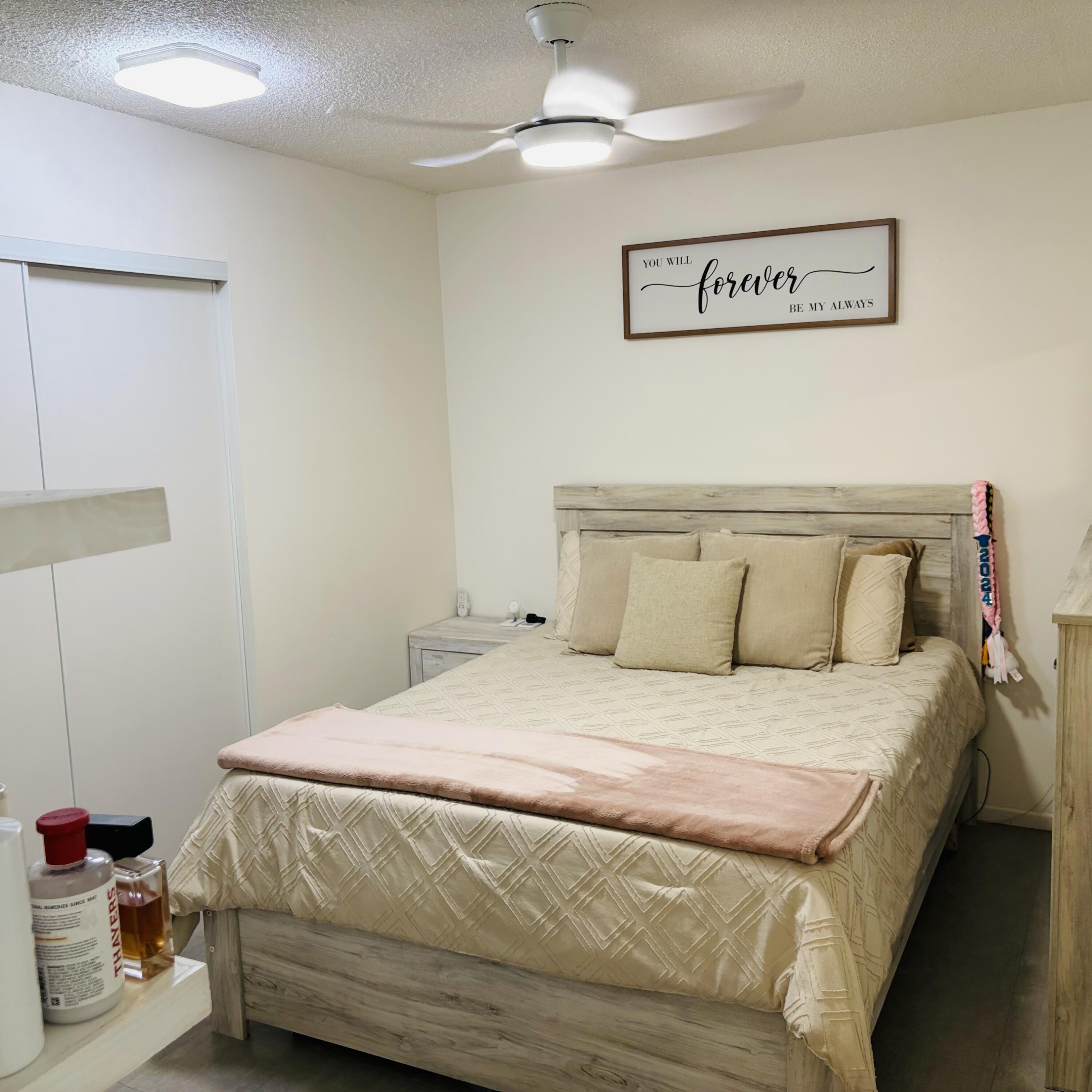 82165 Crest Avenue Indio, CA 92201 - Photo 15 of 37 a bedroom with a bed and closet