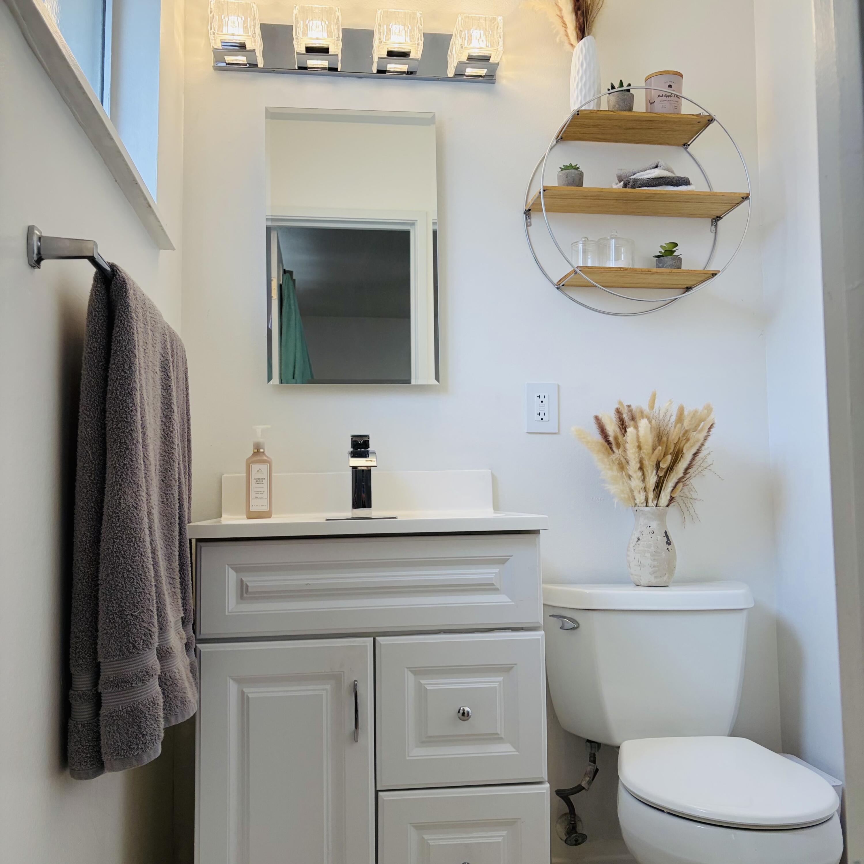 82165 Crest Avenue Indio, CA 92201 - Photo 16 of 37 a bathroom with a toilet a sink and mirror
