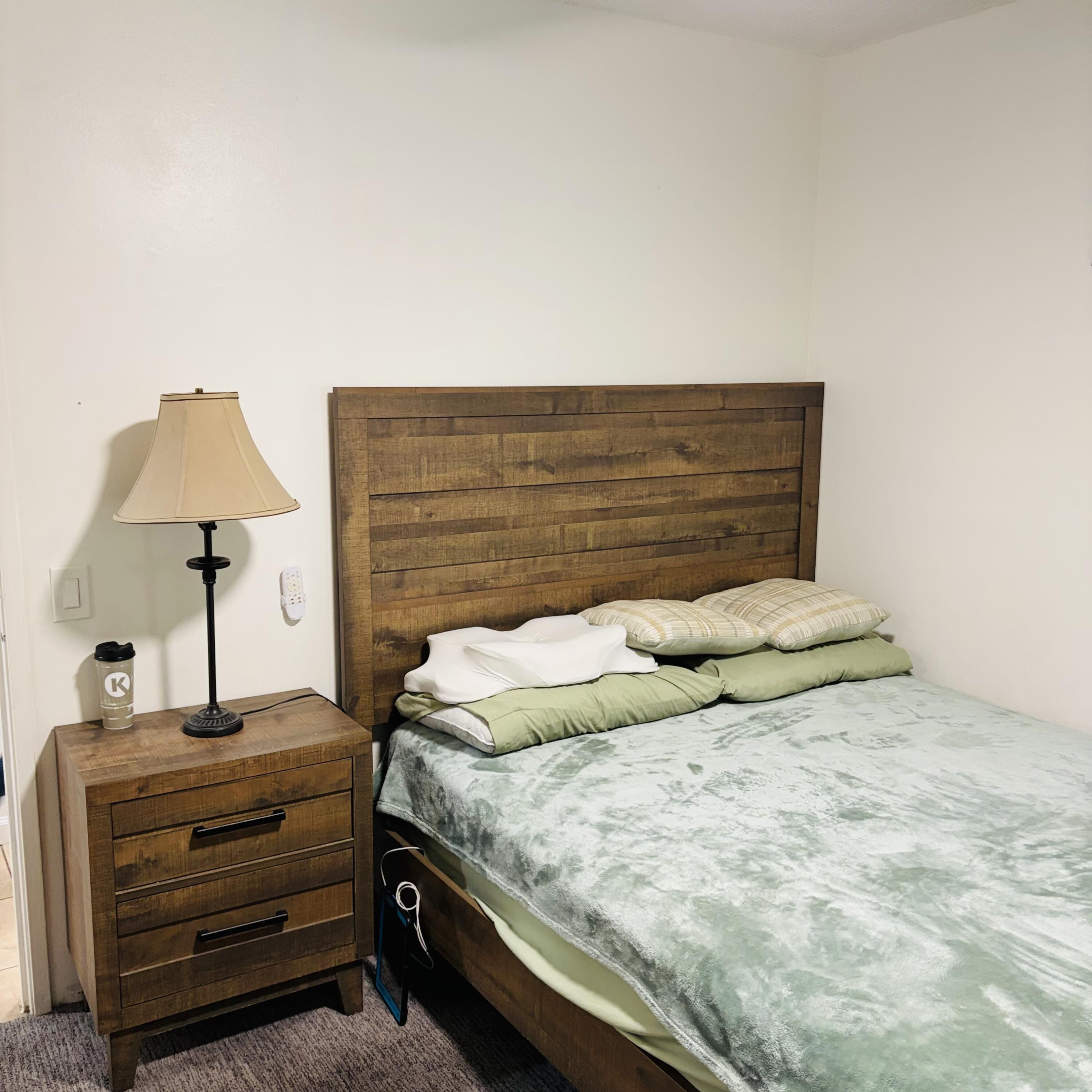82165 Crest Avenue Indio, CA 92201 - Photo 20 of 37 a bedroom with a bed and a lamp on dresser