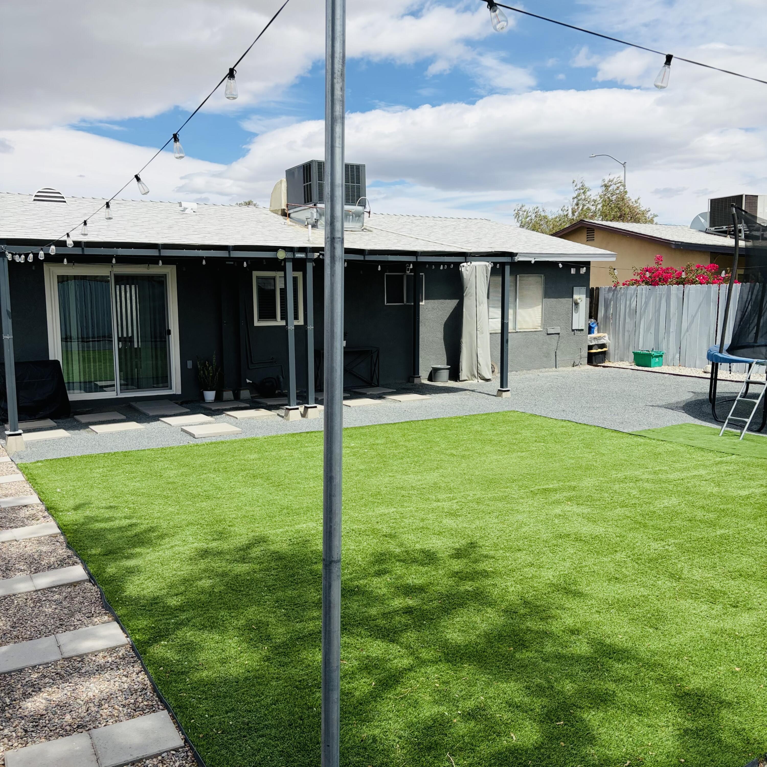 82165 Crest Avenue Indio, CA 92201 - Photo 31 of 37 a front view of a house with a yard