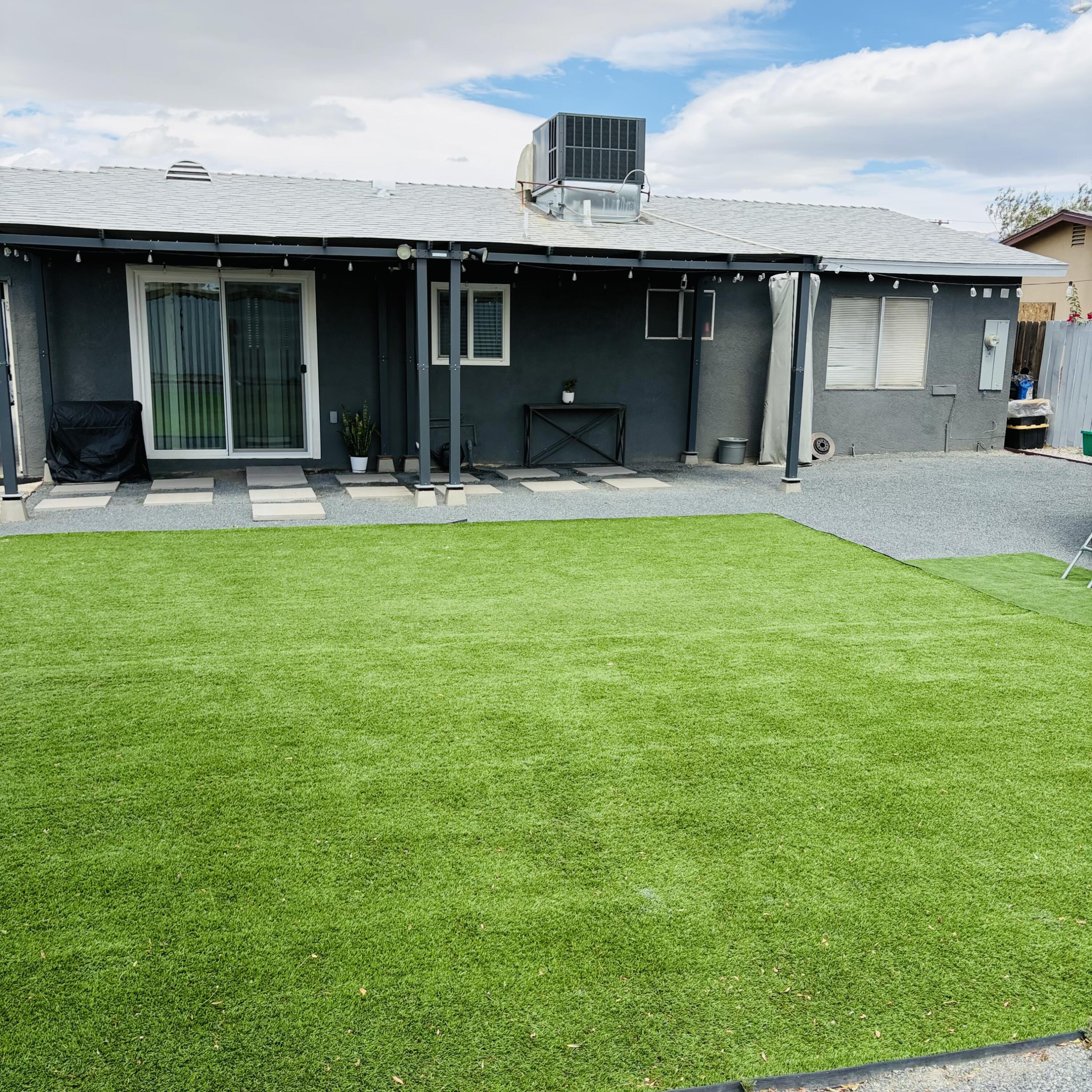 82165 Crest Avenue Indio, CA 92201 - Photo 35 of 37 a front view of a house with a yard