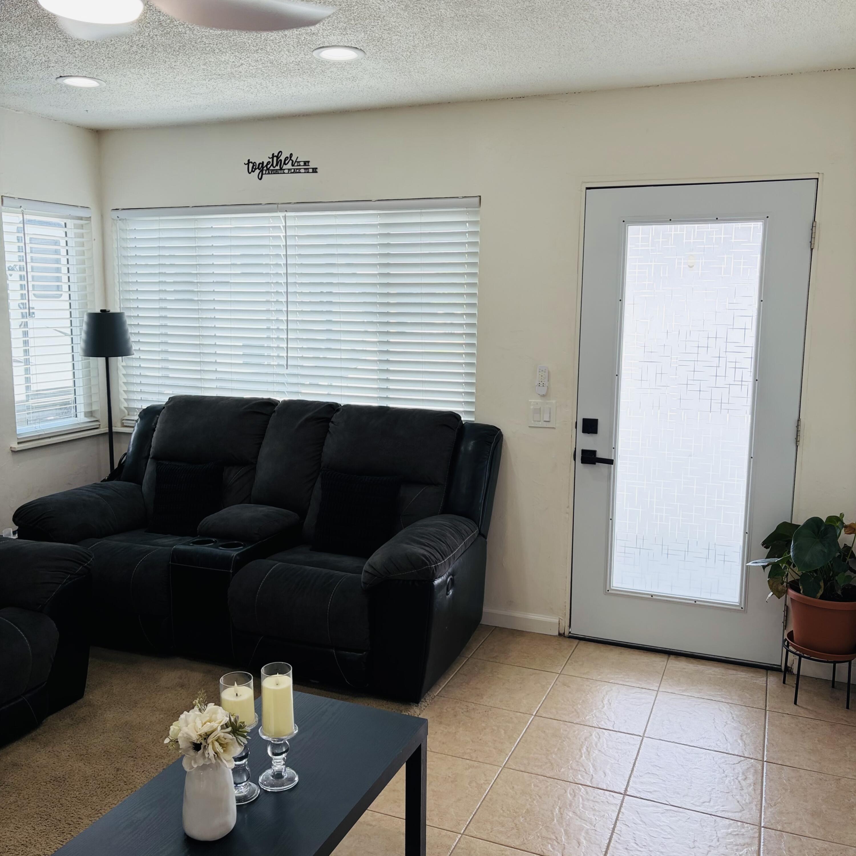 82165 Crest Avenue Indio, CA 92201 - Photo 4 of 37 a living room with furniture and a potted plant