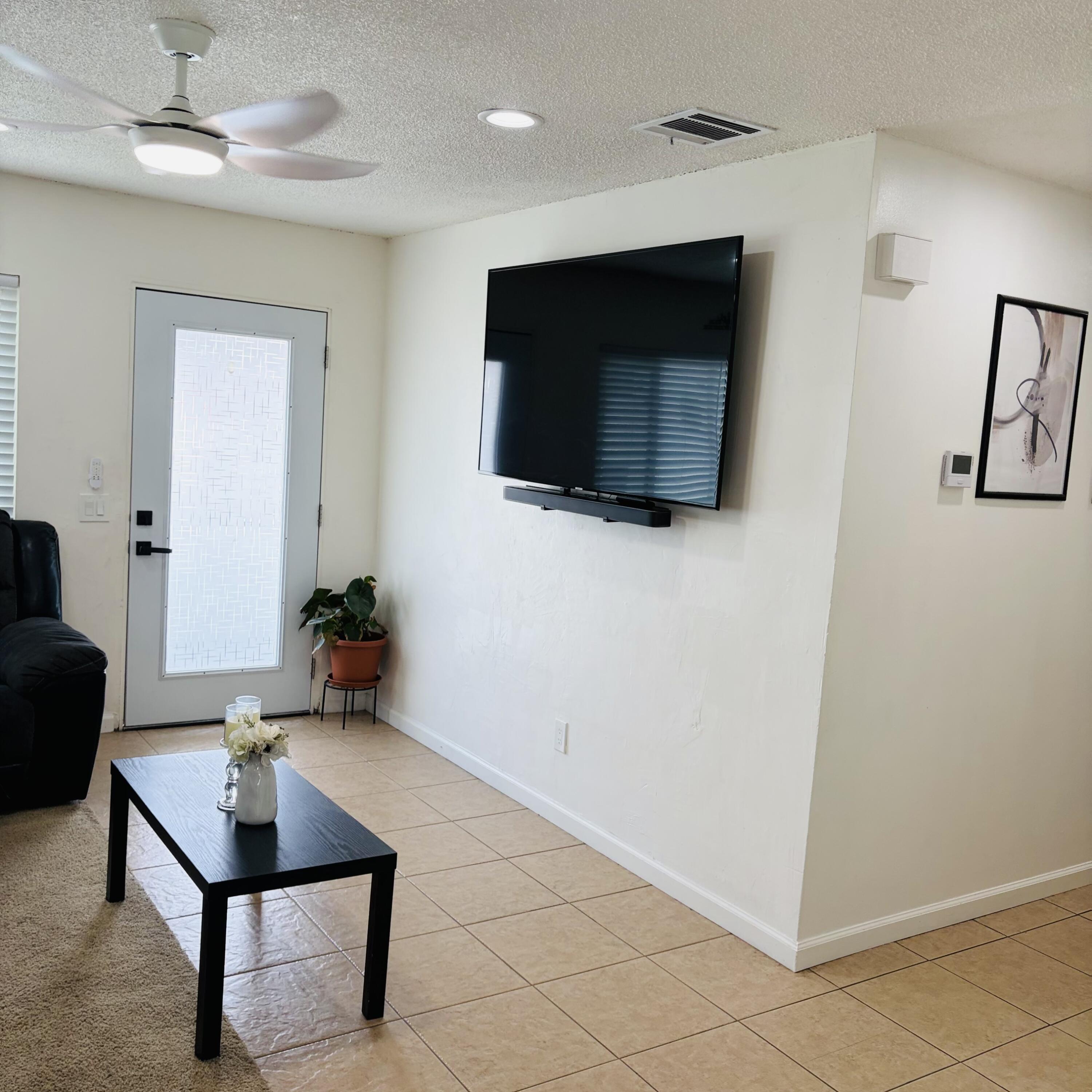 82165 Crest Avenue Indio, CA 92201 - Photo 7 of 37 a living room with furniture and a flat screen tv