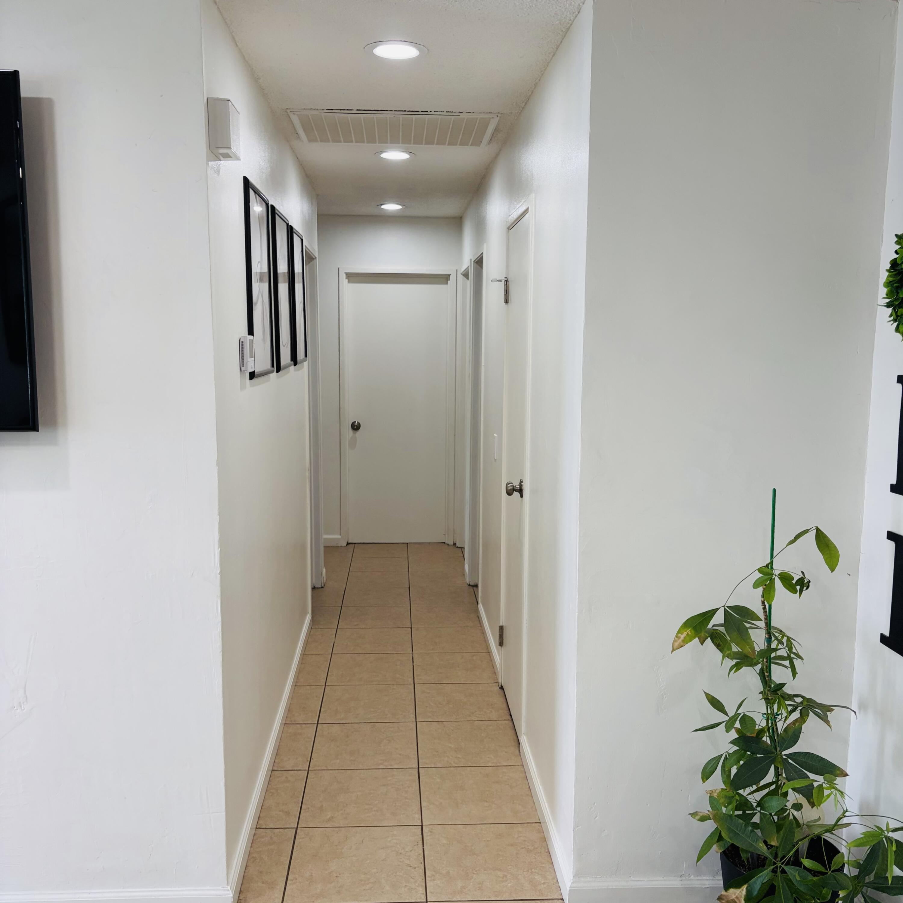 82165 Crest Avenue Indio, CA 92201 - Photo 8 of 37 a hallway with painting and flowers