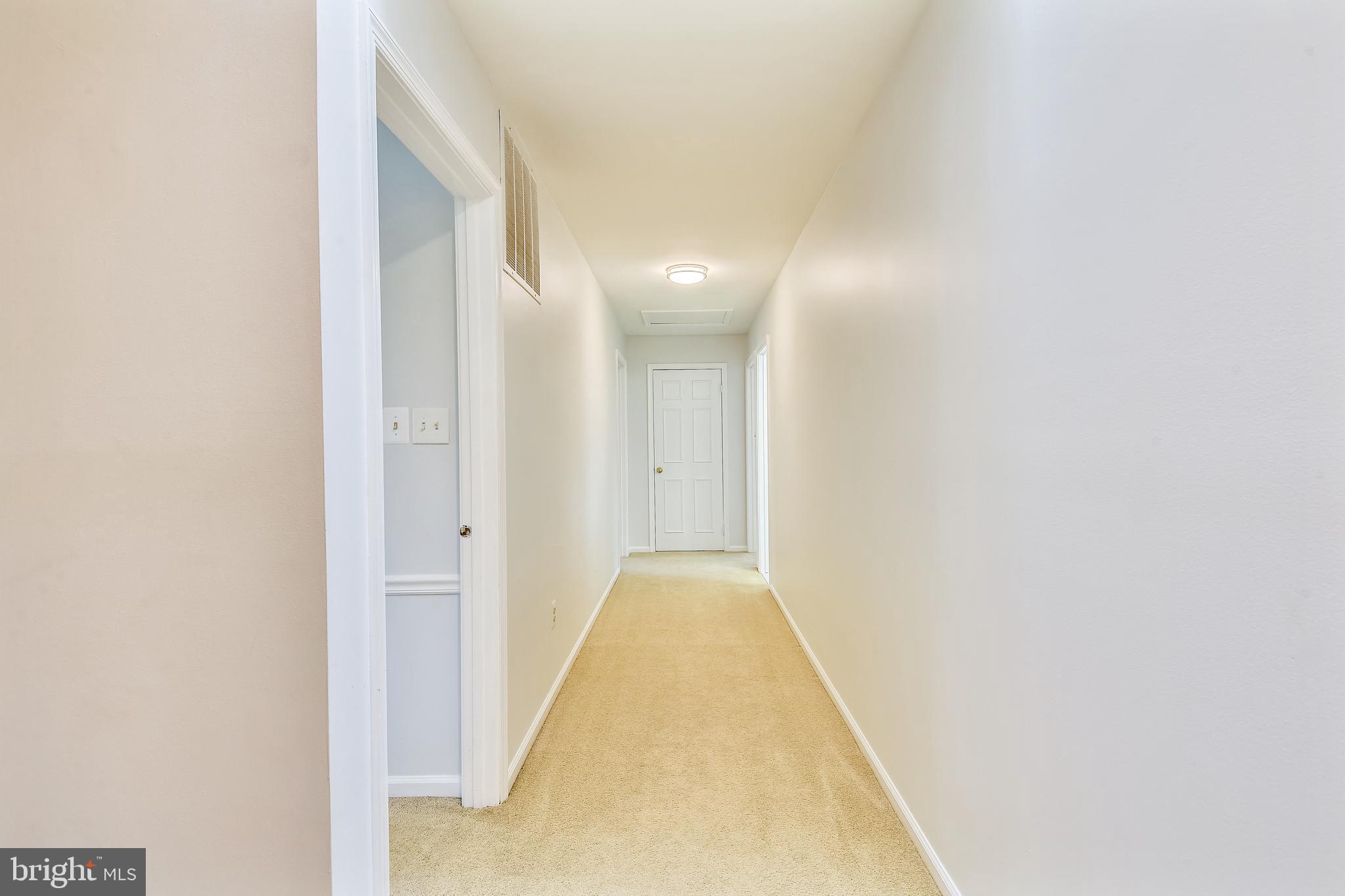 11620 Deer Forest Road Reston, VA 20194 - Photo 34 of 57 Upstairs hallway with skylight