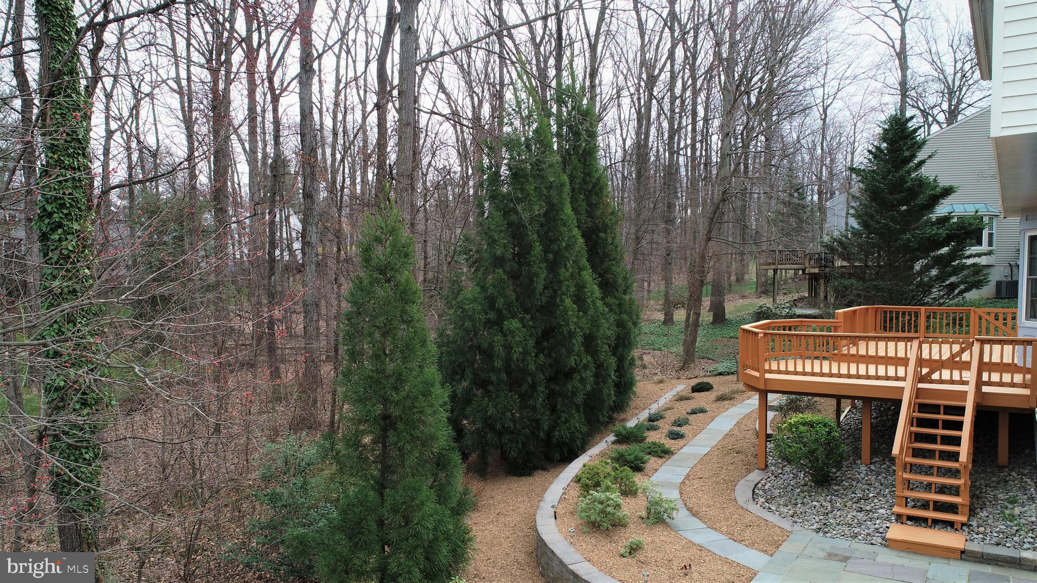 11620 Deer Forest Road Reston, VA 20194 - Photo 46 of 57 Stone and slate hardscaping in the rear