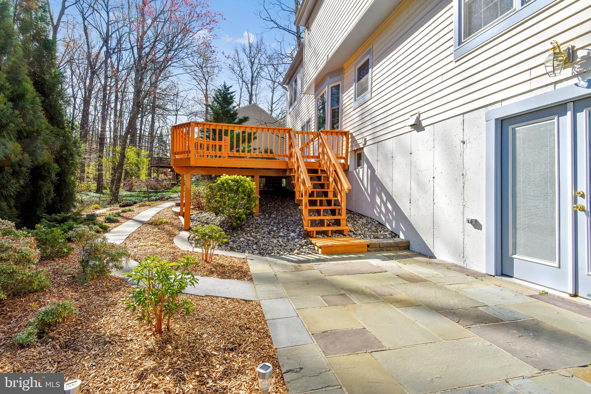 11620 Deer Forest Road Reston, VA 20194 - Photo 52 of 57 Low lev walkout to slate patio, stone hardscaping