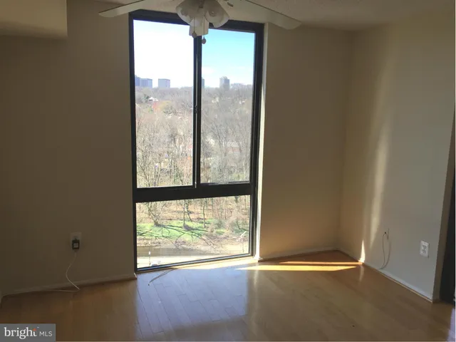 a view of an empty room and window