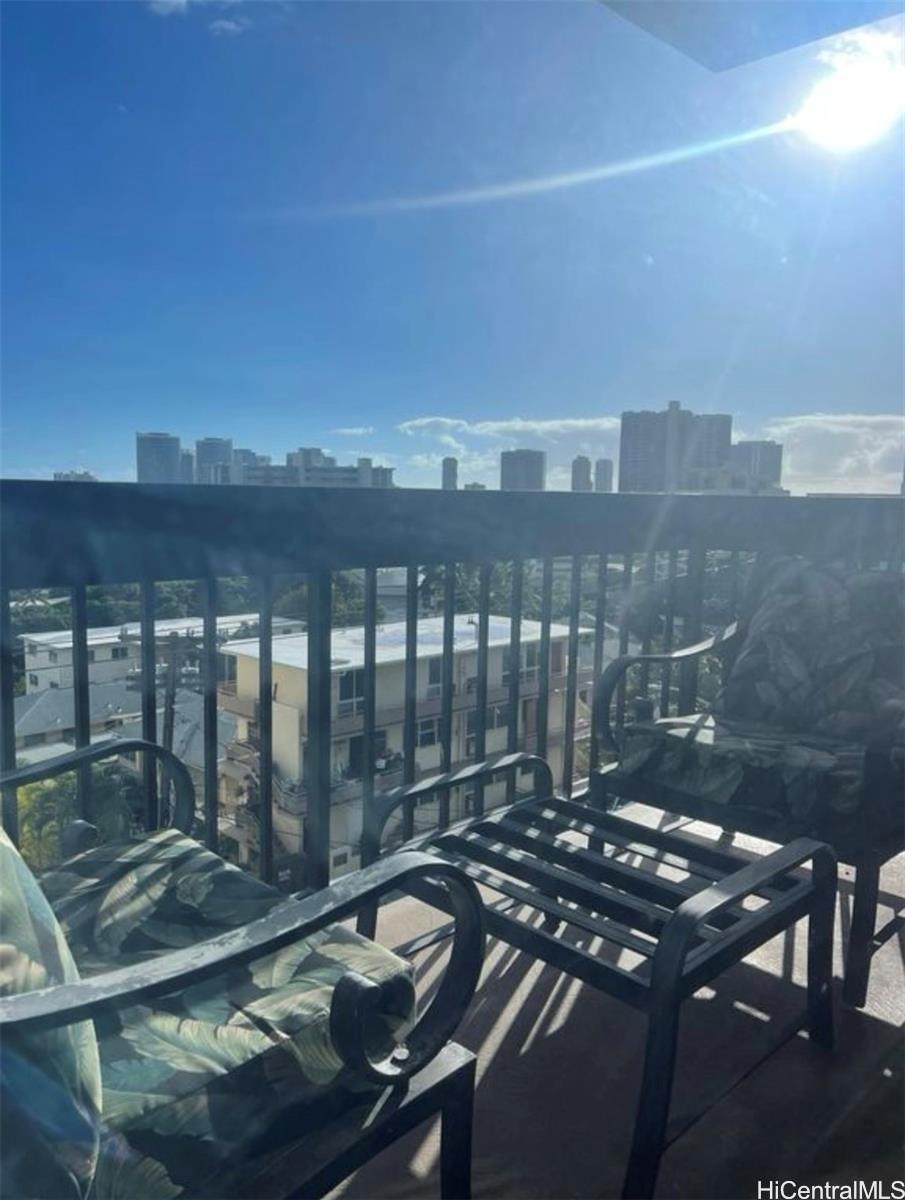 1560 Thurston Avenue, Unit 502 Honolulu, HI 96822 - Photo 1 of 9 a view of a balcony with furniture